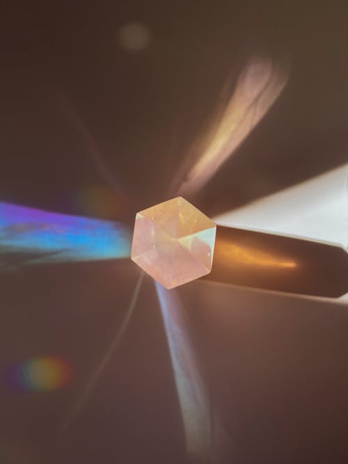 Free A close up of a crystal with a rainbow Stock Photo