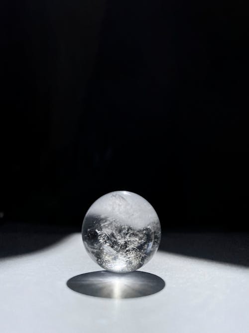 Free A glass ball with a shadow on it Stock Photo