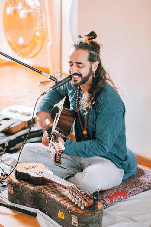 Free stock photo of arab man, audio equipment, guitar Stock Photo
